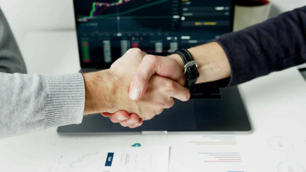 technology partnership handshake