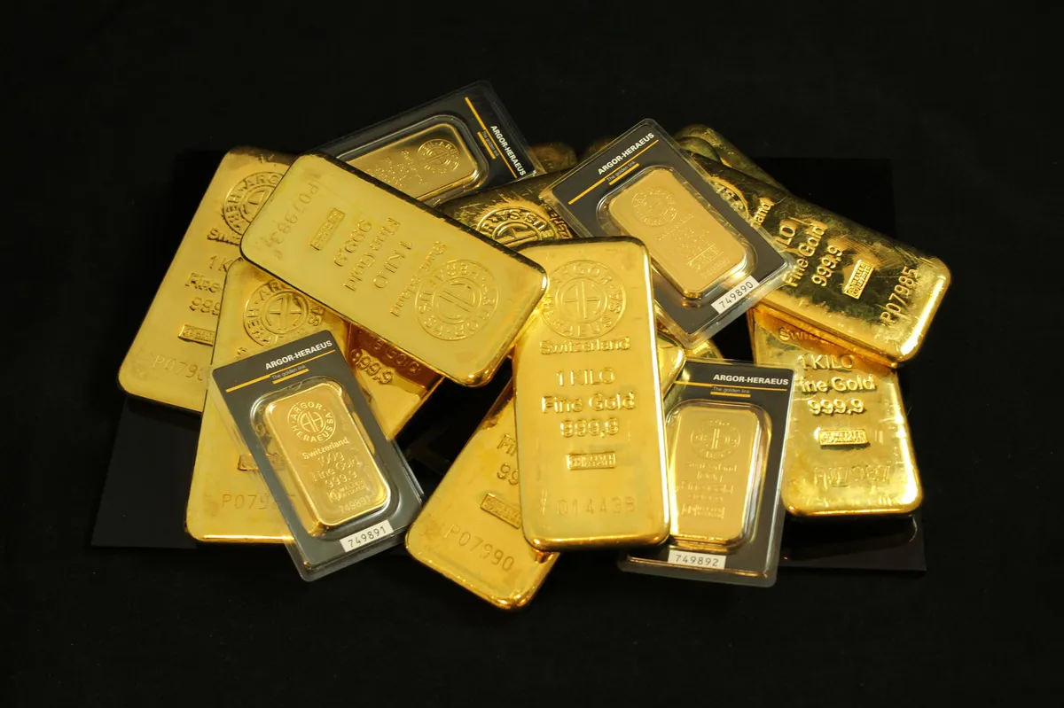 gold bars stacked in vault