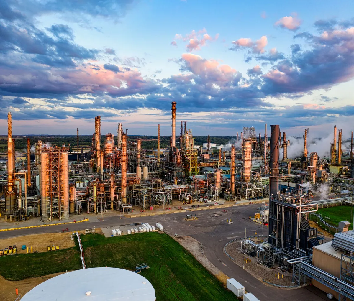 oil refinery at sunset