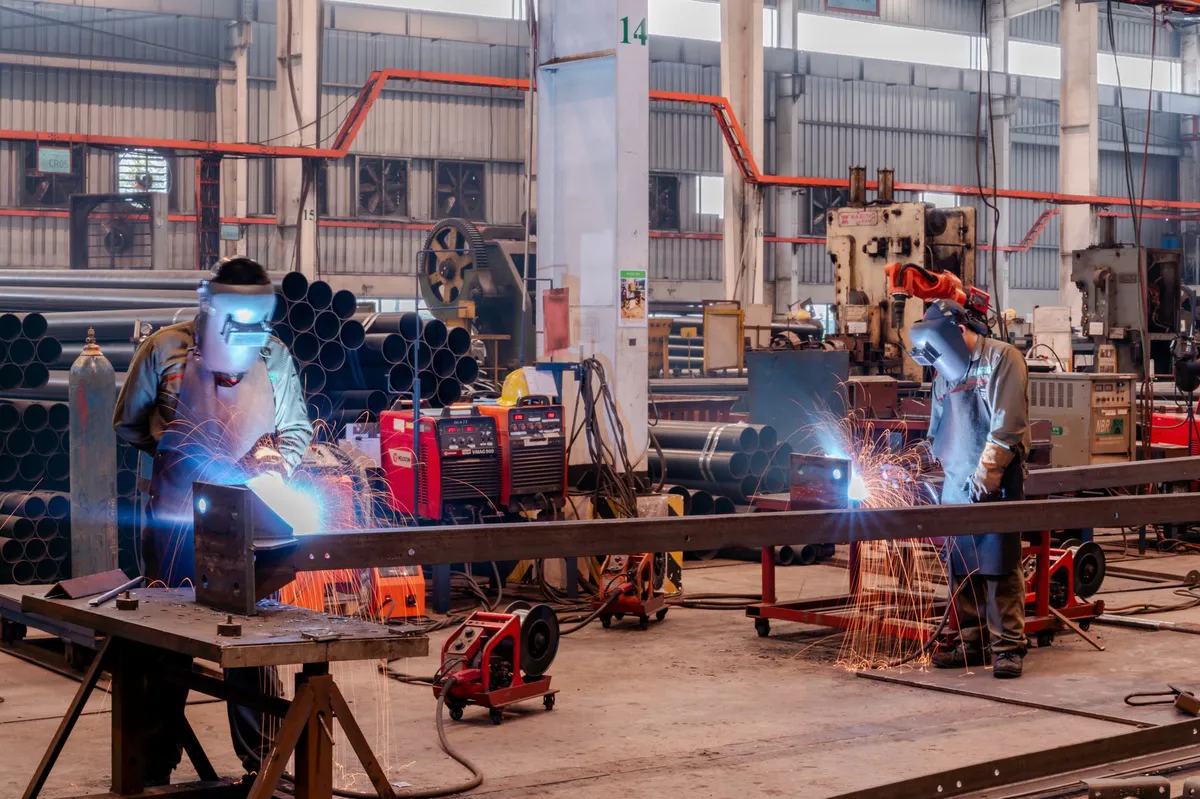 workers in automotive plant