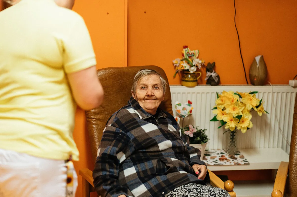 elderly woman with caregiver