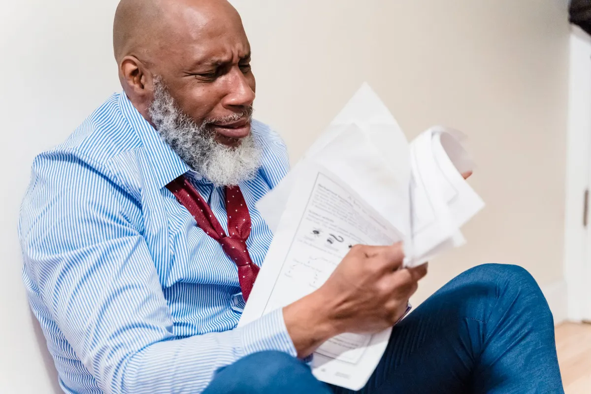 worried retiree looking at paperwork