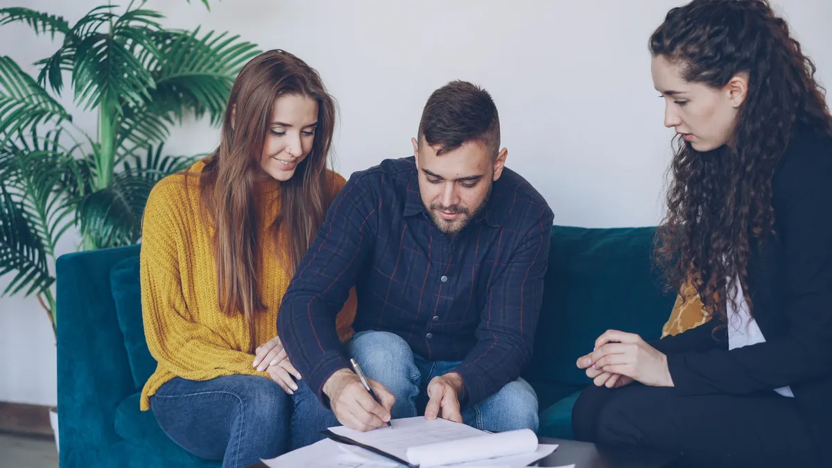 financial adviser consulting with couple