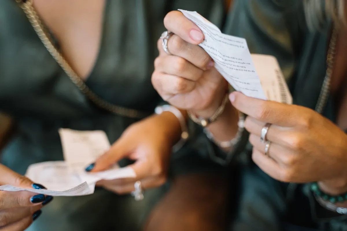 consumer looking at receipt