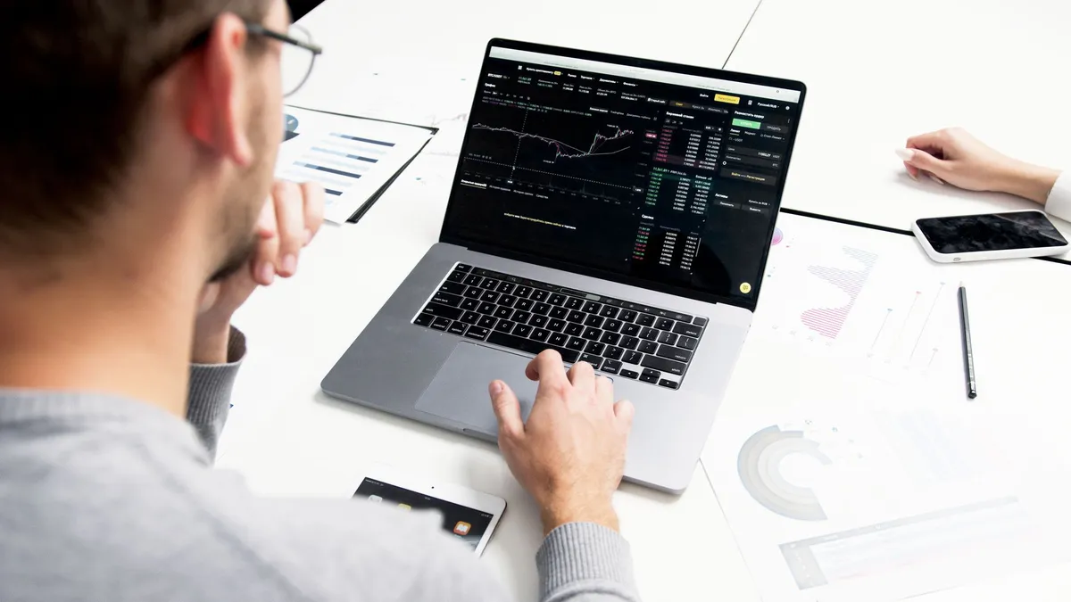 person analyzing investment options