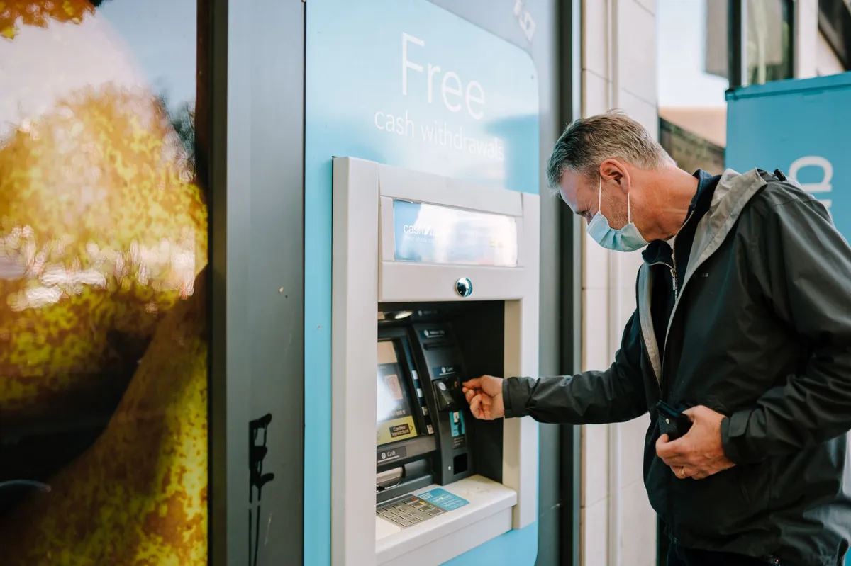 senior using an ATM