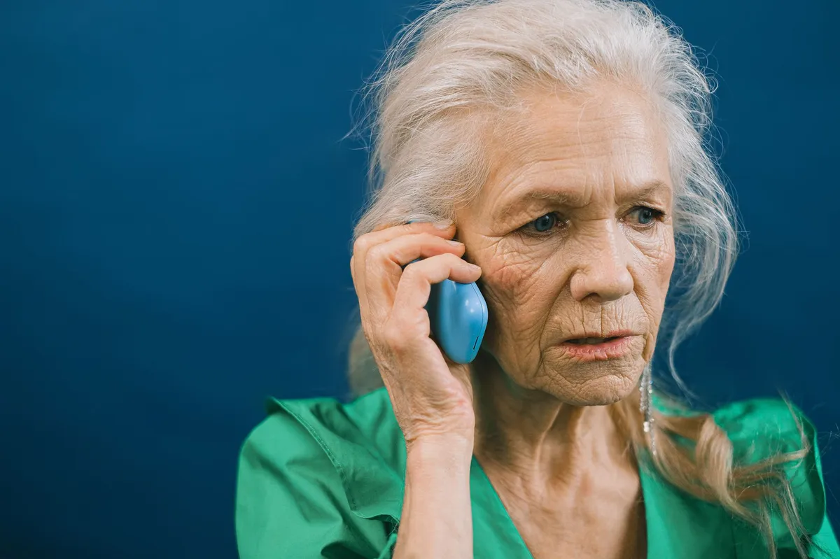 elderly person on phone