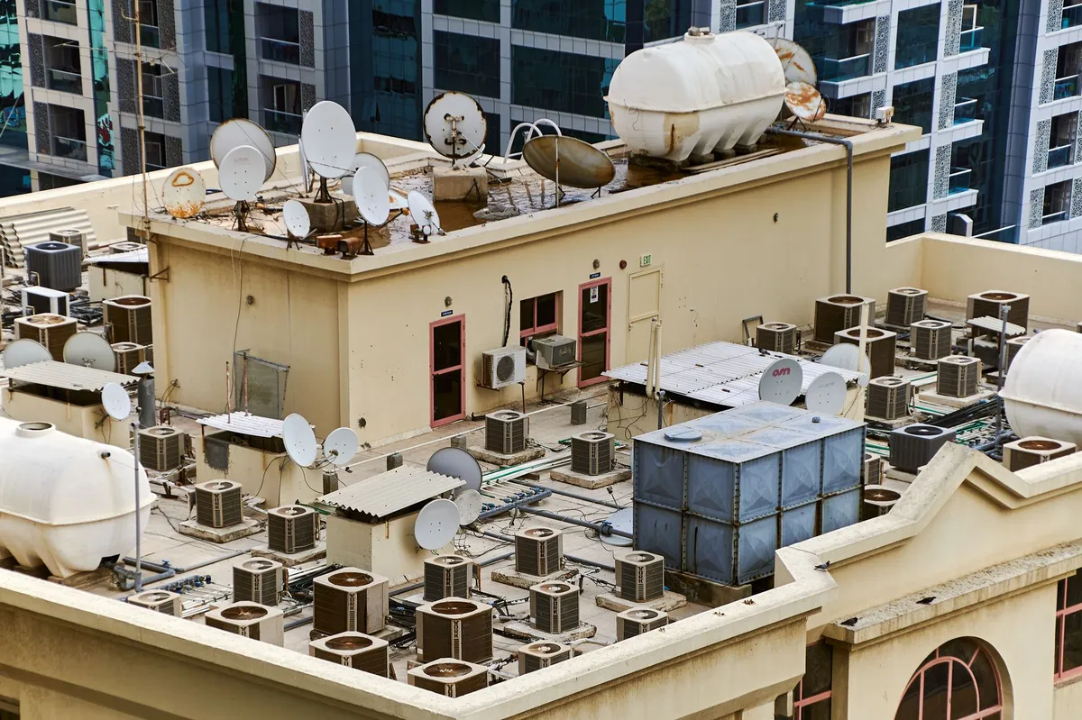 bustling city skyline with air conditioning units