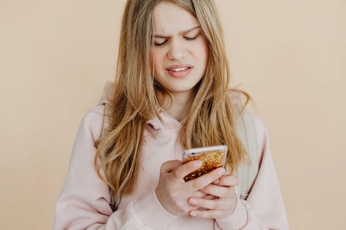 person looking at suspicious text