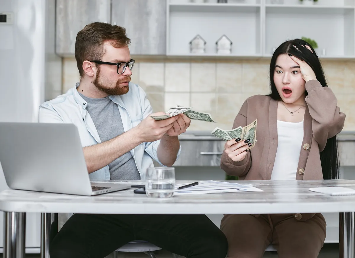 happy young adults budgeting