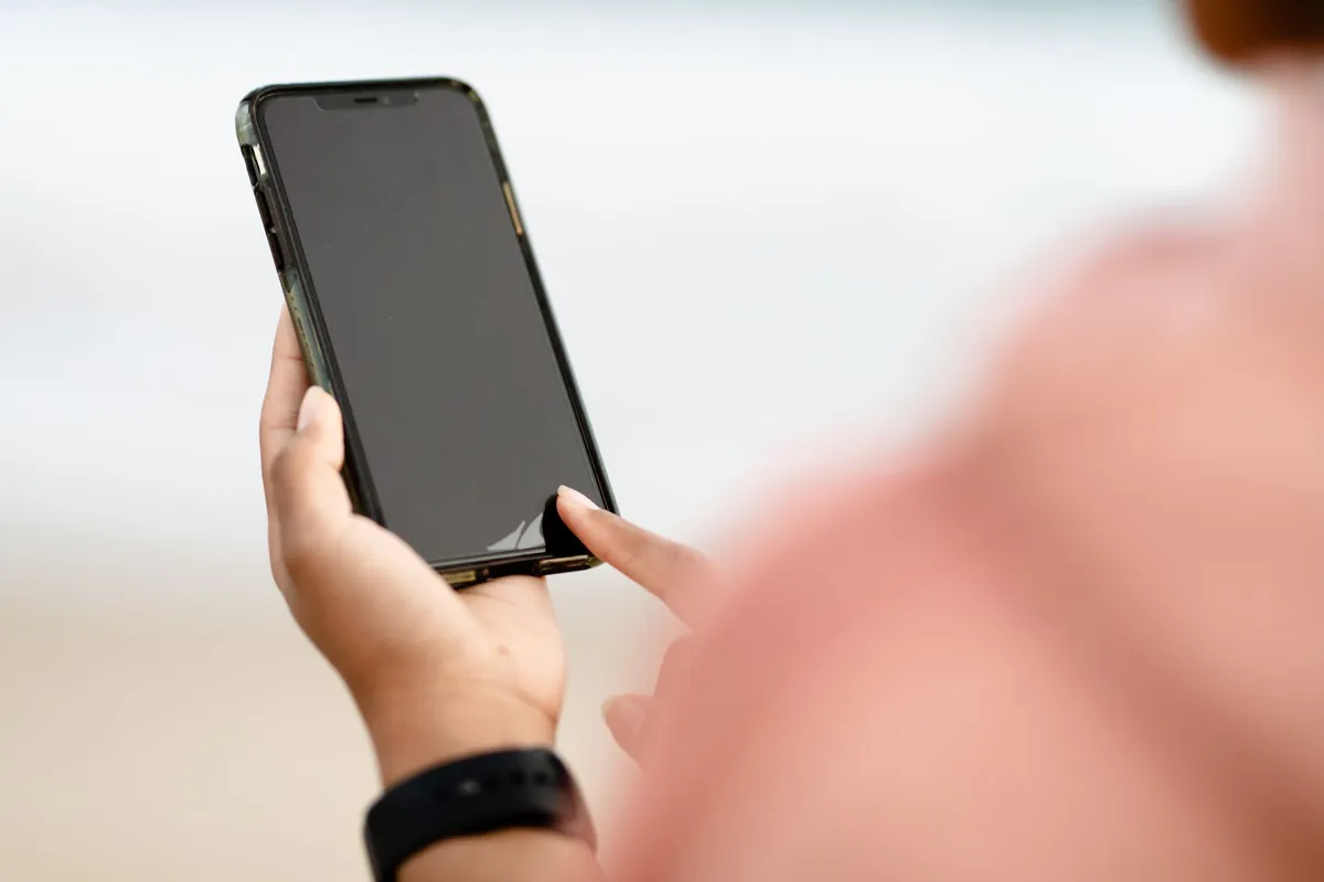 close up of a person looking at a smartphone