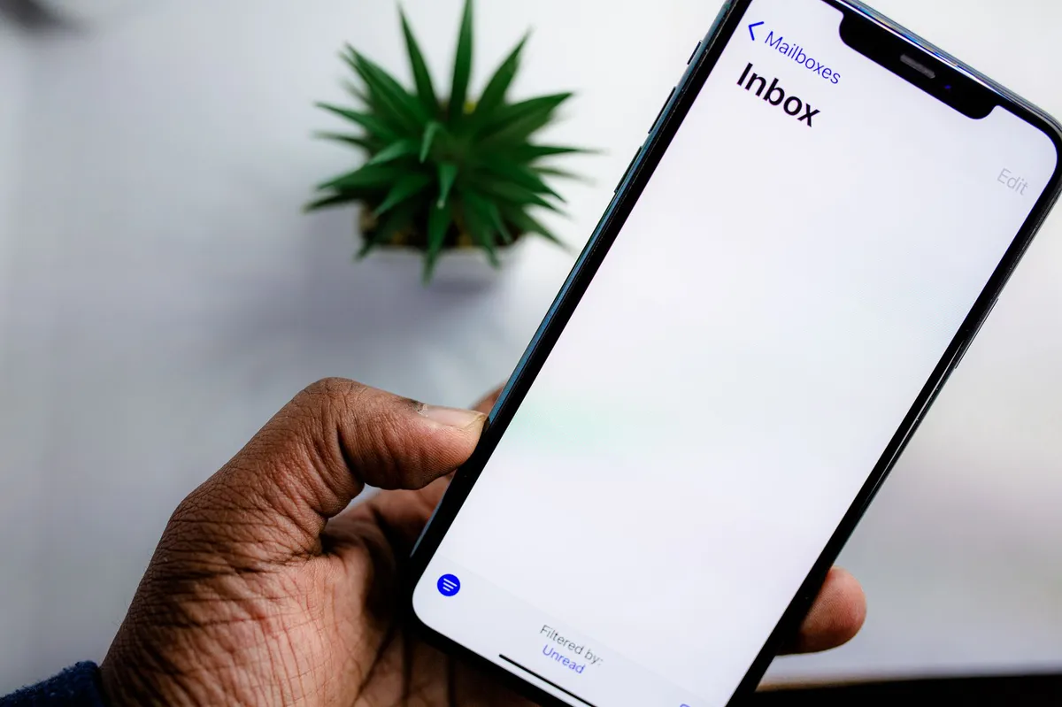 person checking email on smartphone