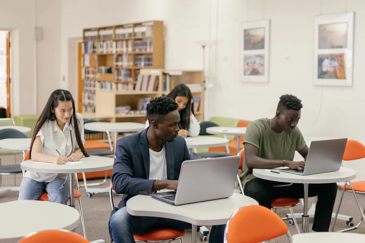 college student studying with laptop