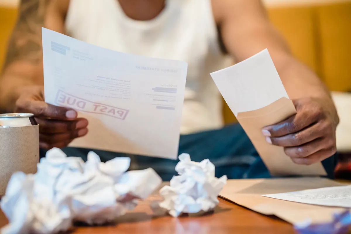 stressed person reviewing bills
