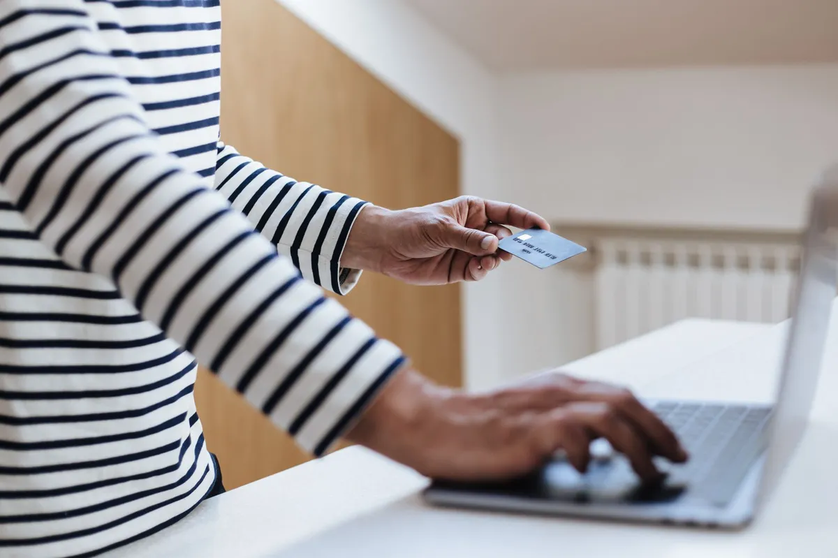 person using credit card for shopping