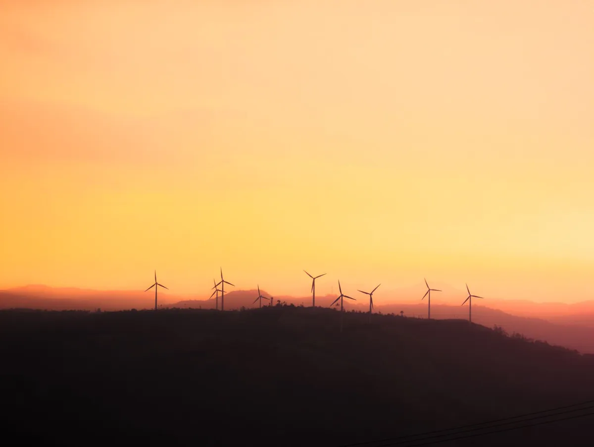 wind turbines at sunset