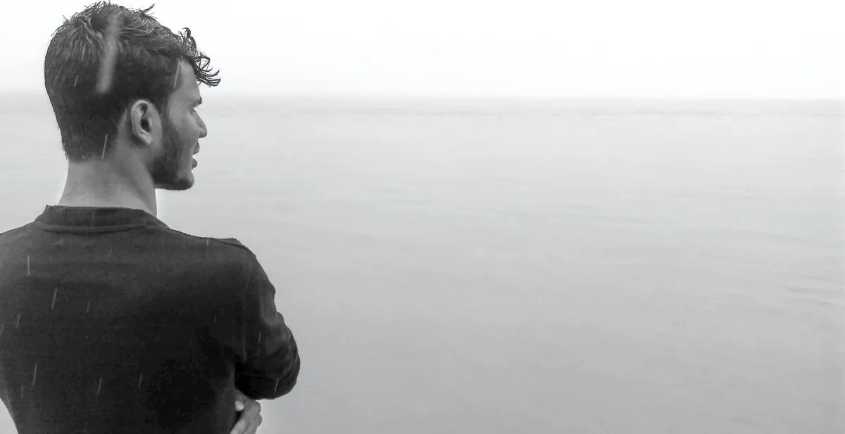 thoughtful person looking at horizon
