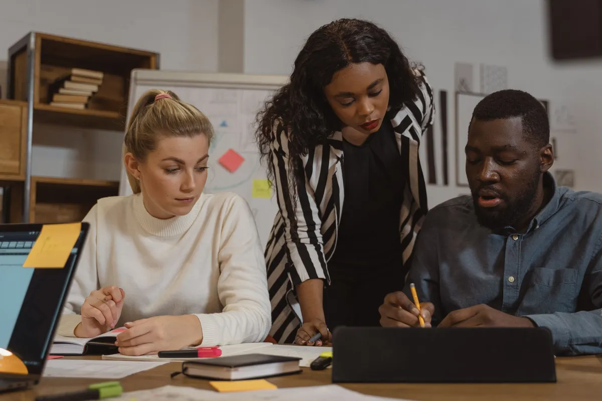 employees collaborating on AI tools