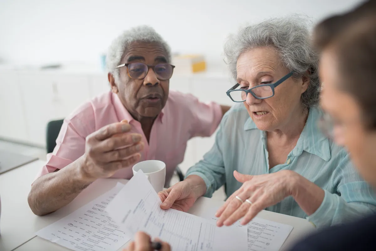 senior homeowners discussing finances