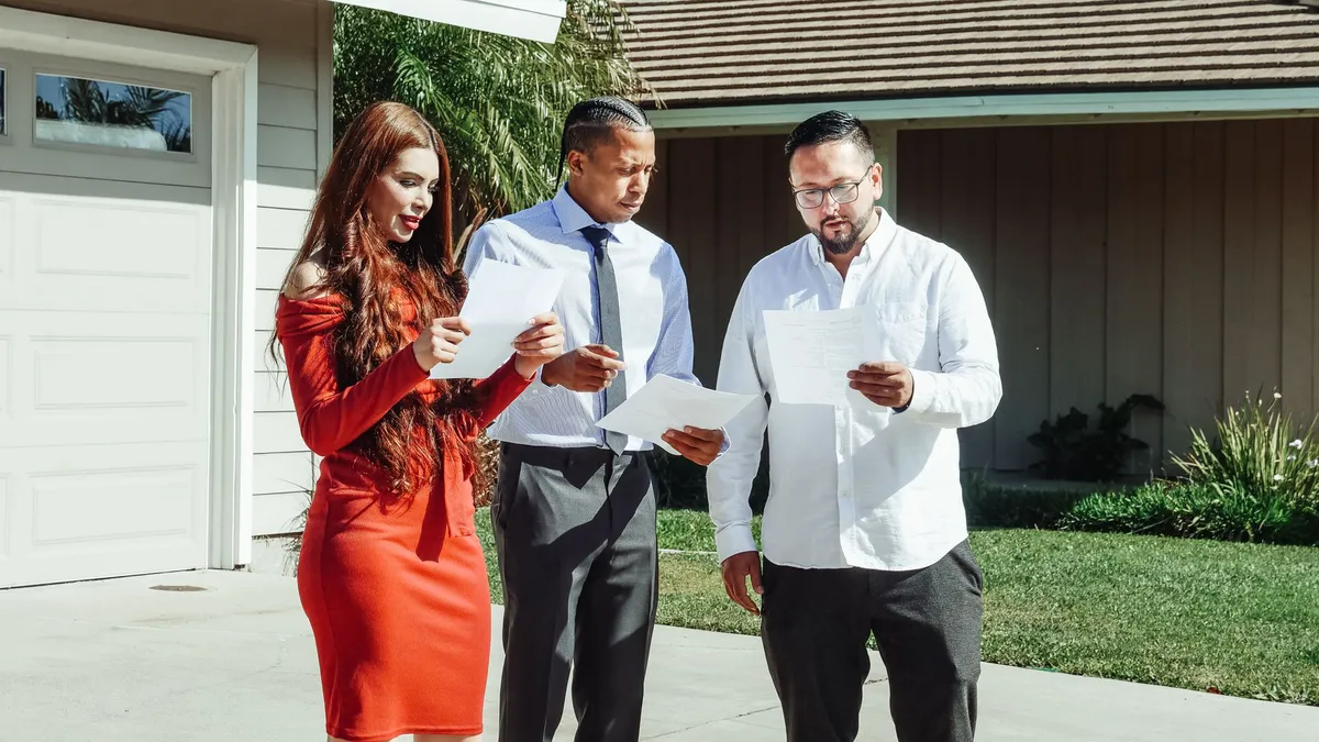couple reviewing home sale documents