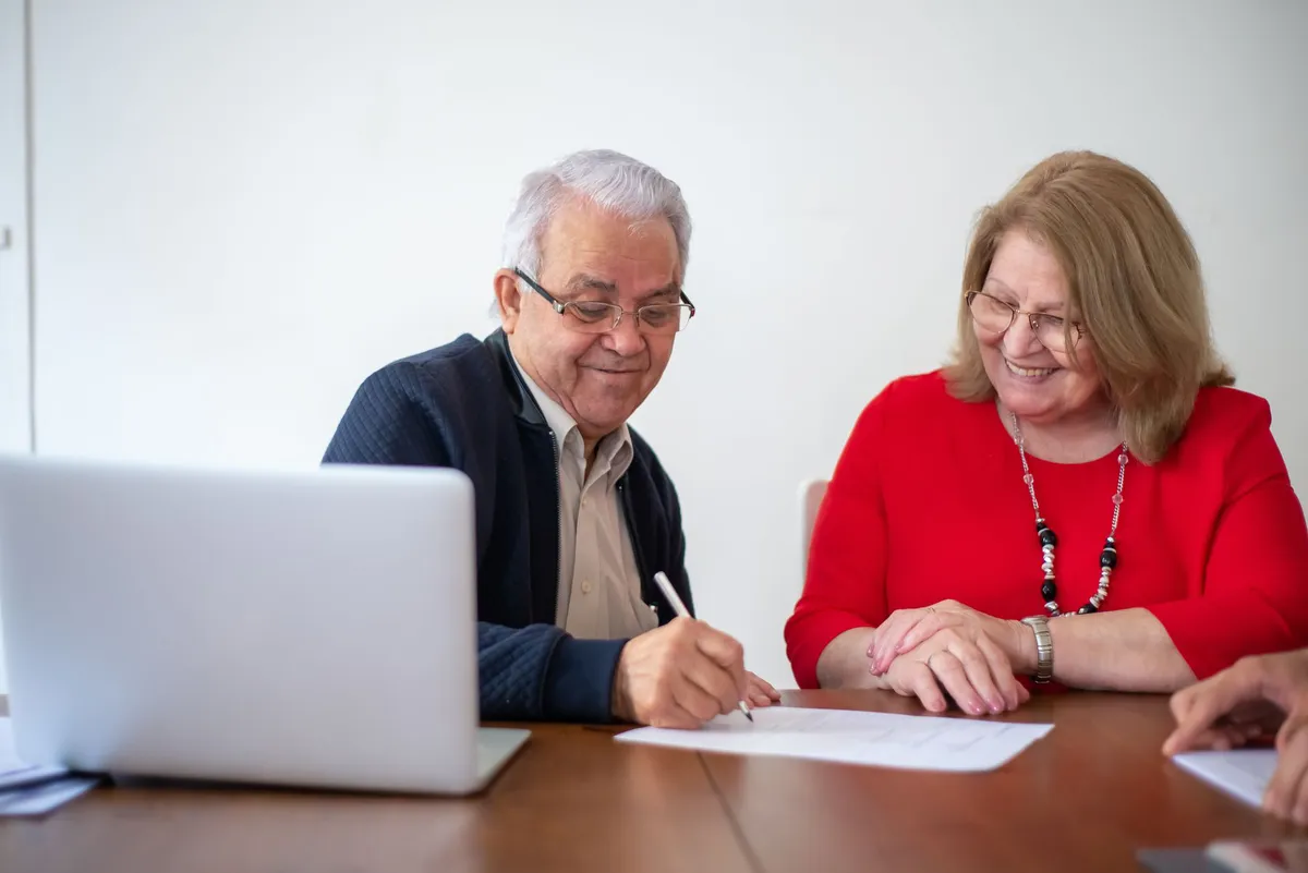 happy retired couple discussing finances