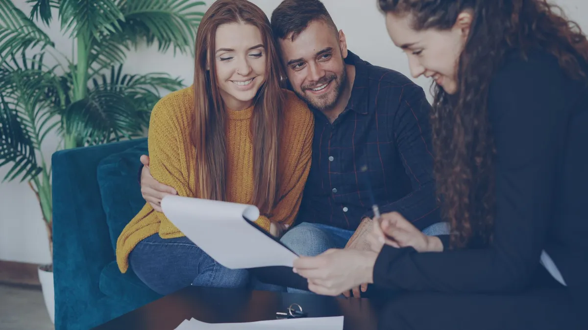 happy couple reviewing financial documents