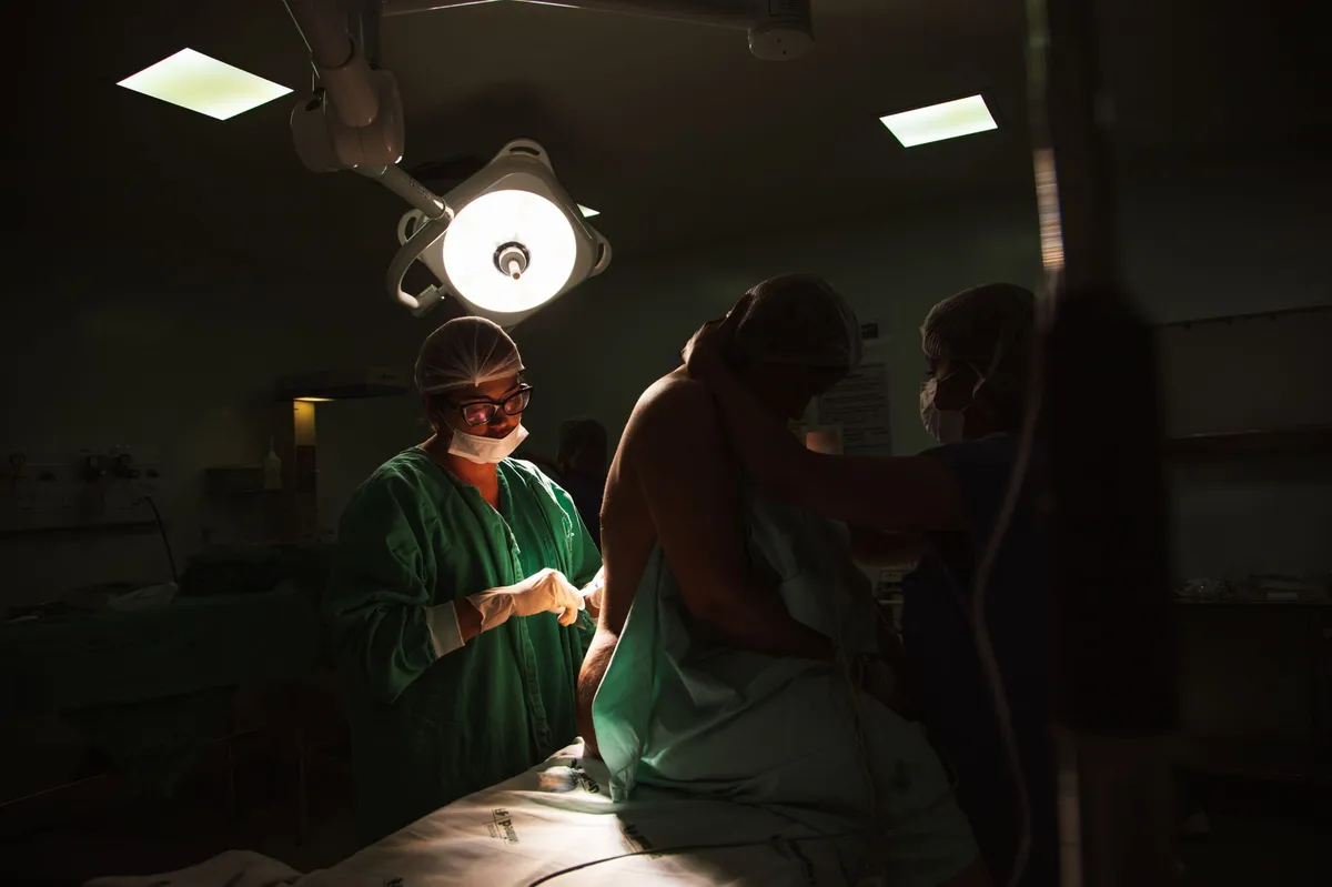 healthcare professionals assisting patient