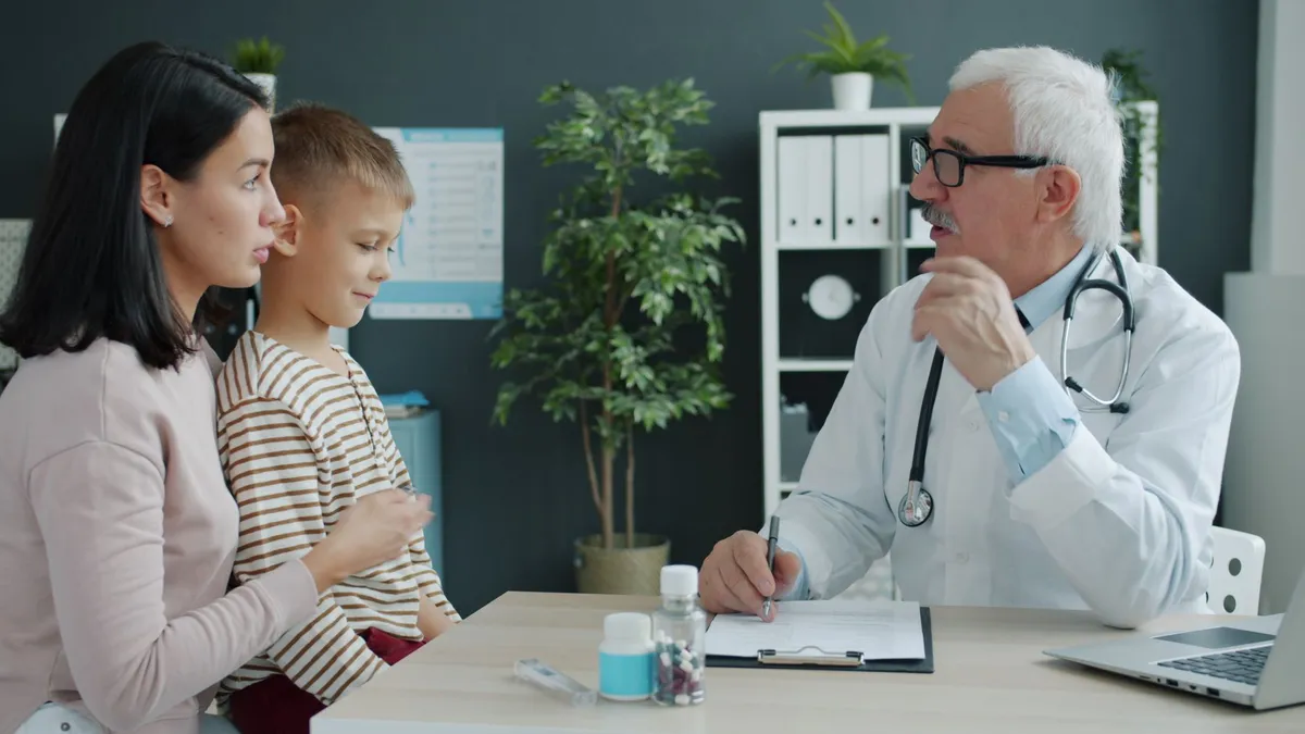 pediatrician consulting with family