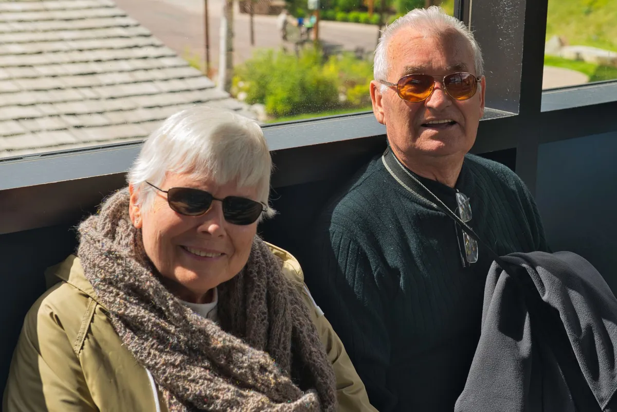 happy elderly couple traveling