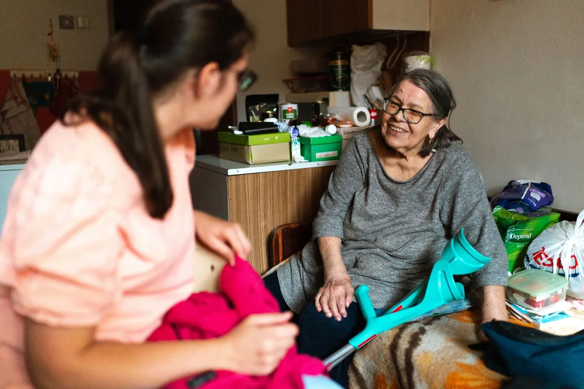 family caregiver helping elderly