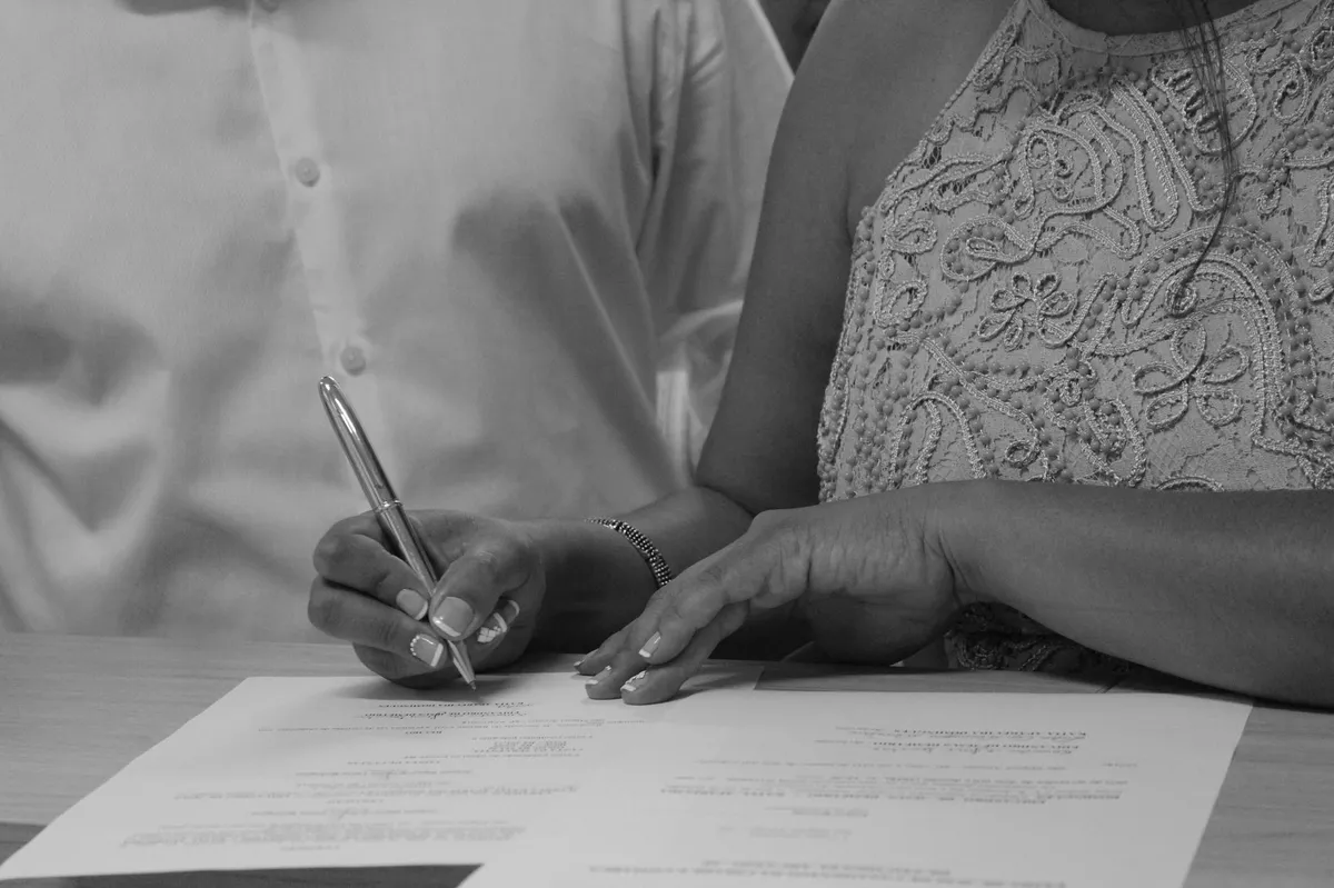 couple signing legal documents
