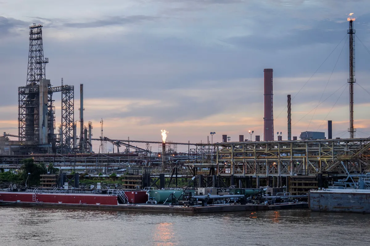 oil refinery at sunset