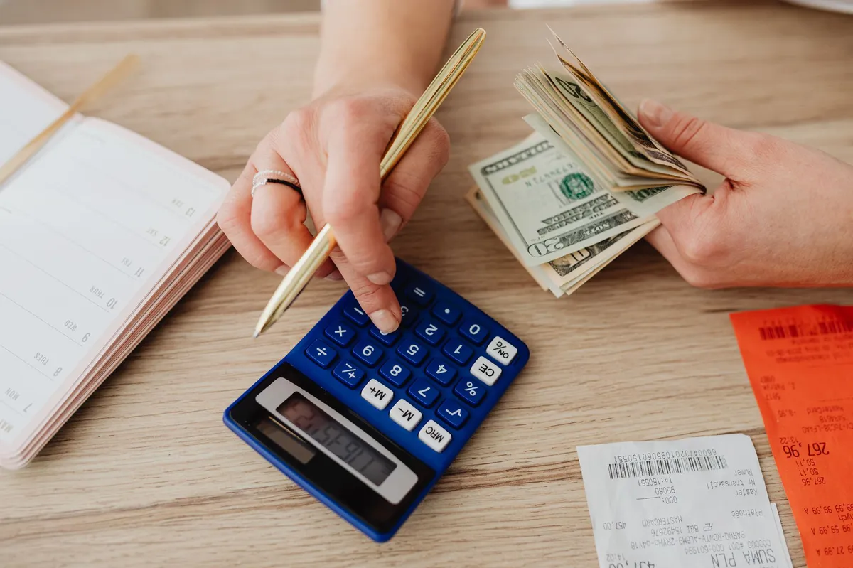 person calculating savings