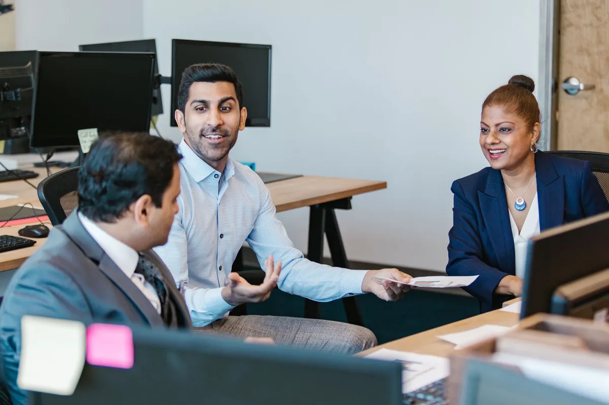 office employees discussing benefits