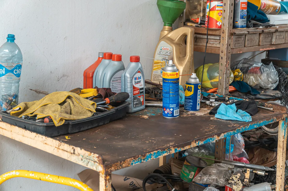 oil change tools on garage floor