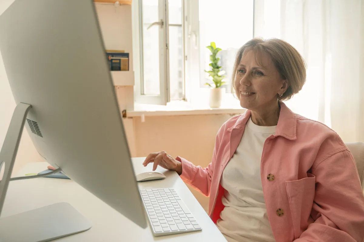 elderly woman using a computer