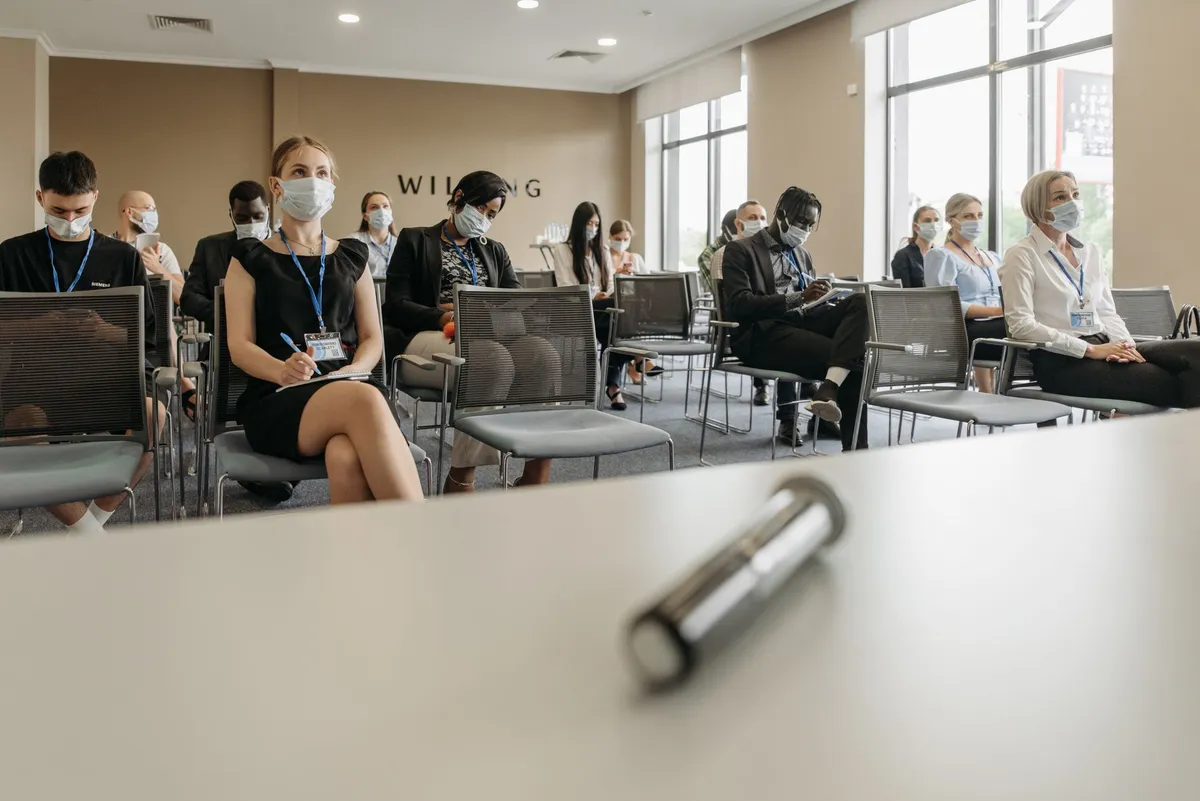 group of people discussing fraud awareness