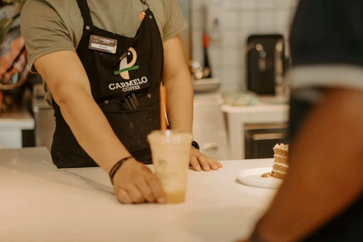 barista serving coffee