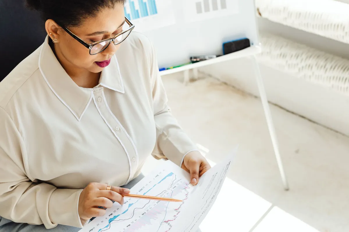 financial analyst reviewing stock data
