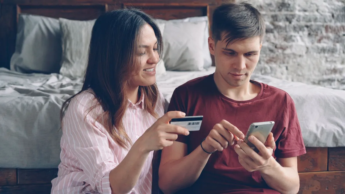 happy couple using banking app
