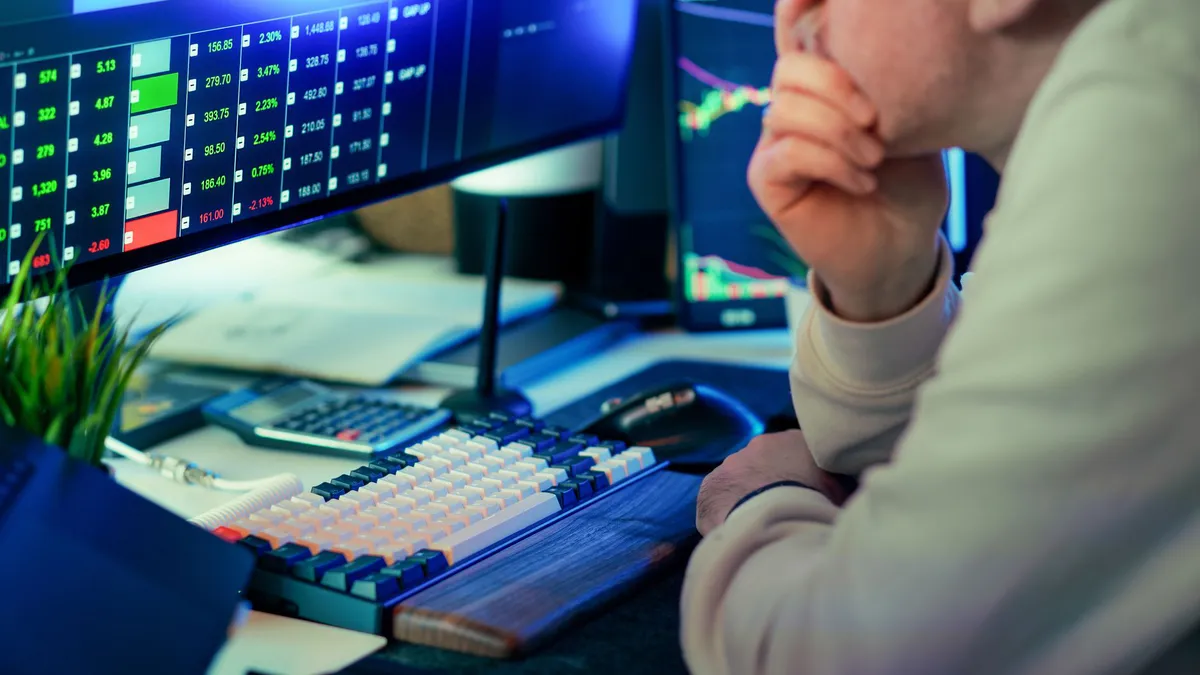 thoughtful investor contemplating